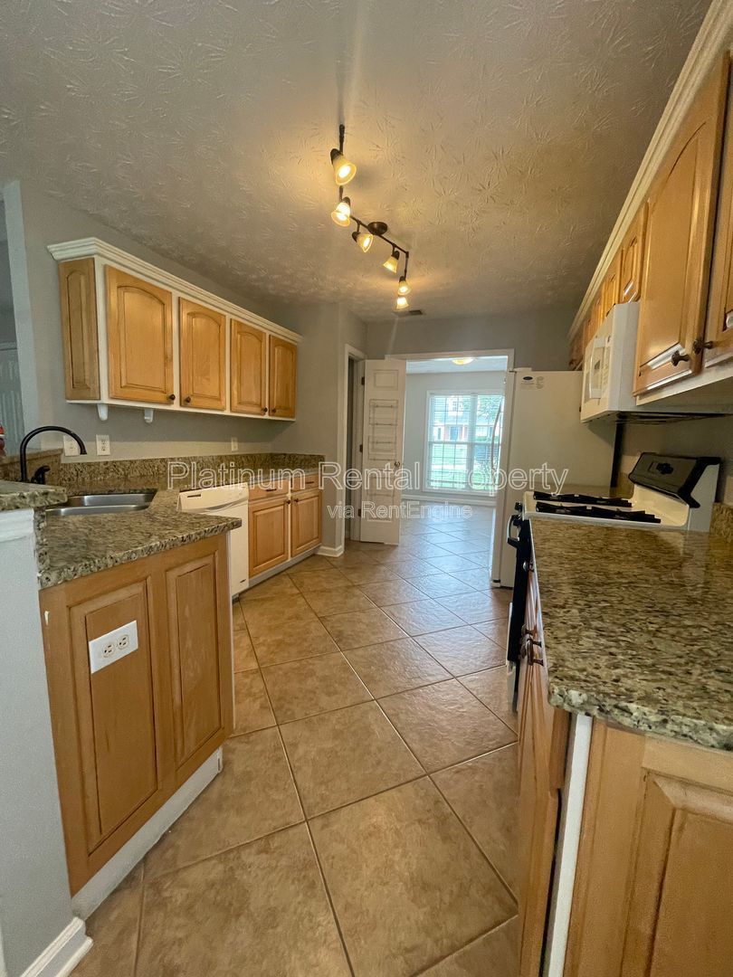 Desirable 4 bedroom floorplan featuring primary suite on the main level by Platinum Property Management Services, Inc. property image