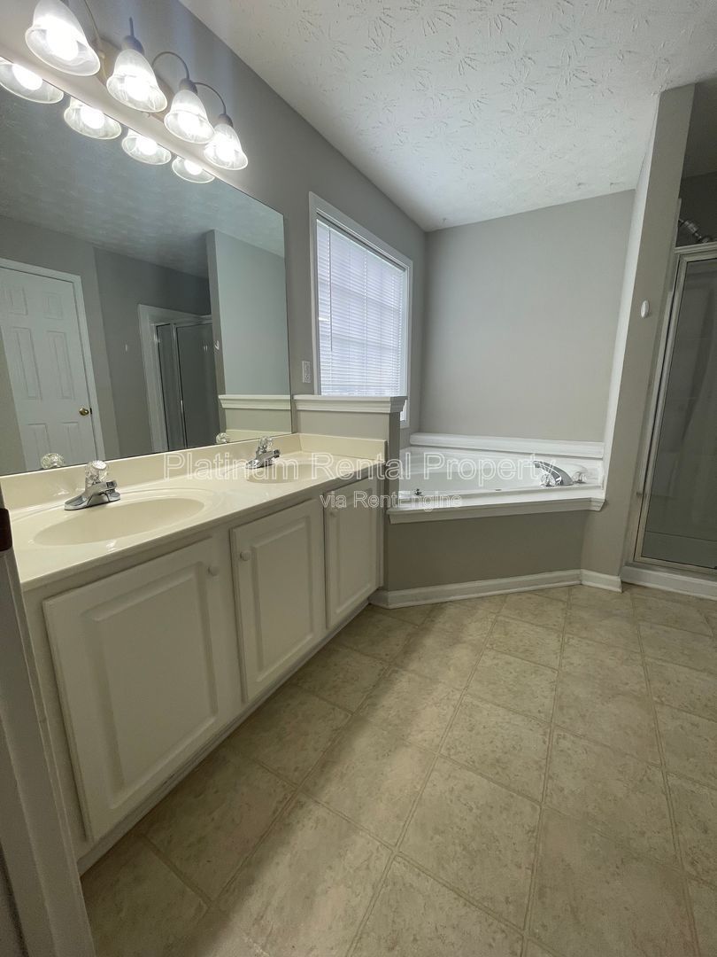 Desirable 4 bedroom floorplan featuring primary suite on the main level by Platinum Property Management Services, Inc. property image