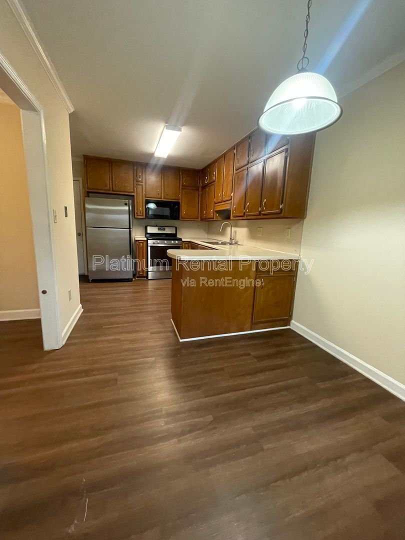 Location, Location, Location! This beautiful and well maintained three-bedroom townhome in convenient Peachtree Corners location is brought to you by Platinum Property Management Services, Inc. property image