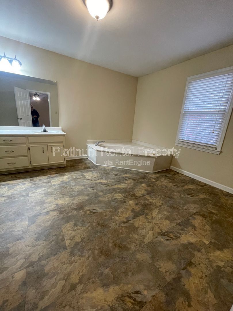 Location, Location, Location! This beautiful and well maintained three-bedroom townhome in convenient Peachtree Corners location is brought to you by Platinum Property Management Services, Inc. property image