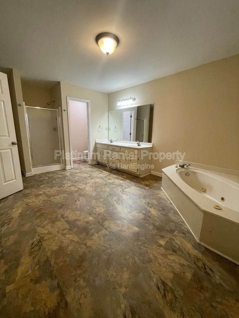 Location, Location, Location! This beautiful and well maintained three-bedroom townhome in convenient Peachtree Corners location is brought to you by Platinum Property Management Services, Inc. property image