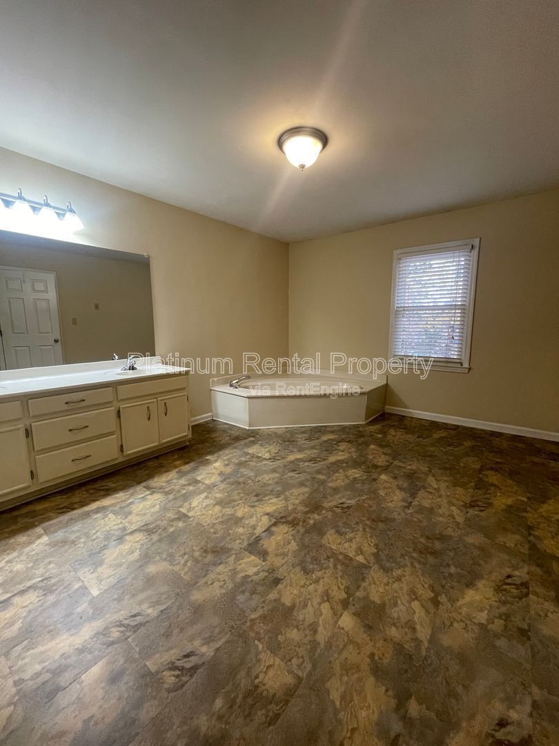 Location, Location, Location! This beautiful and well maintained three-bedroom townhome in convenient Peachtree Corners location is brought to you by Platinum Property Management Services, Inc. property image